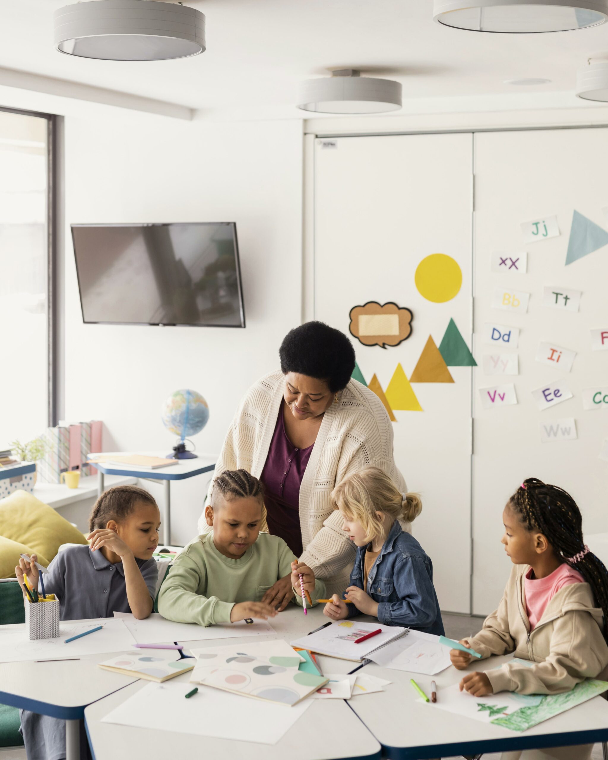 Photo of elementary school classroom with teacher and students.