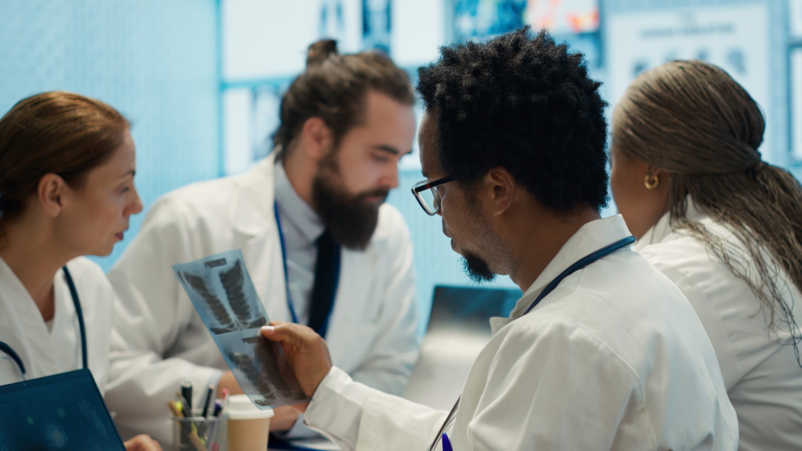 4 medical students taking an examination.