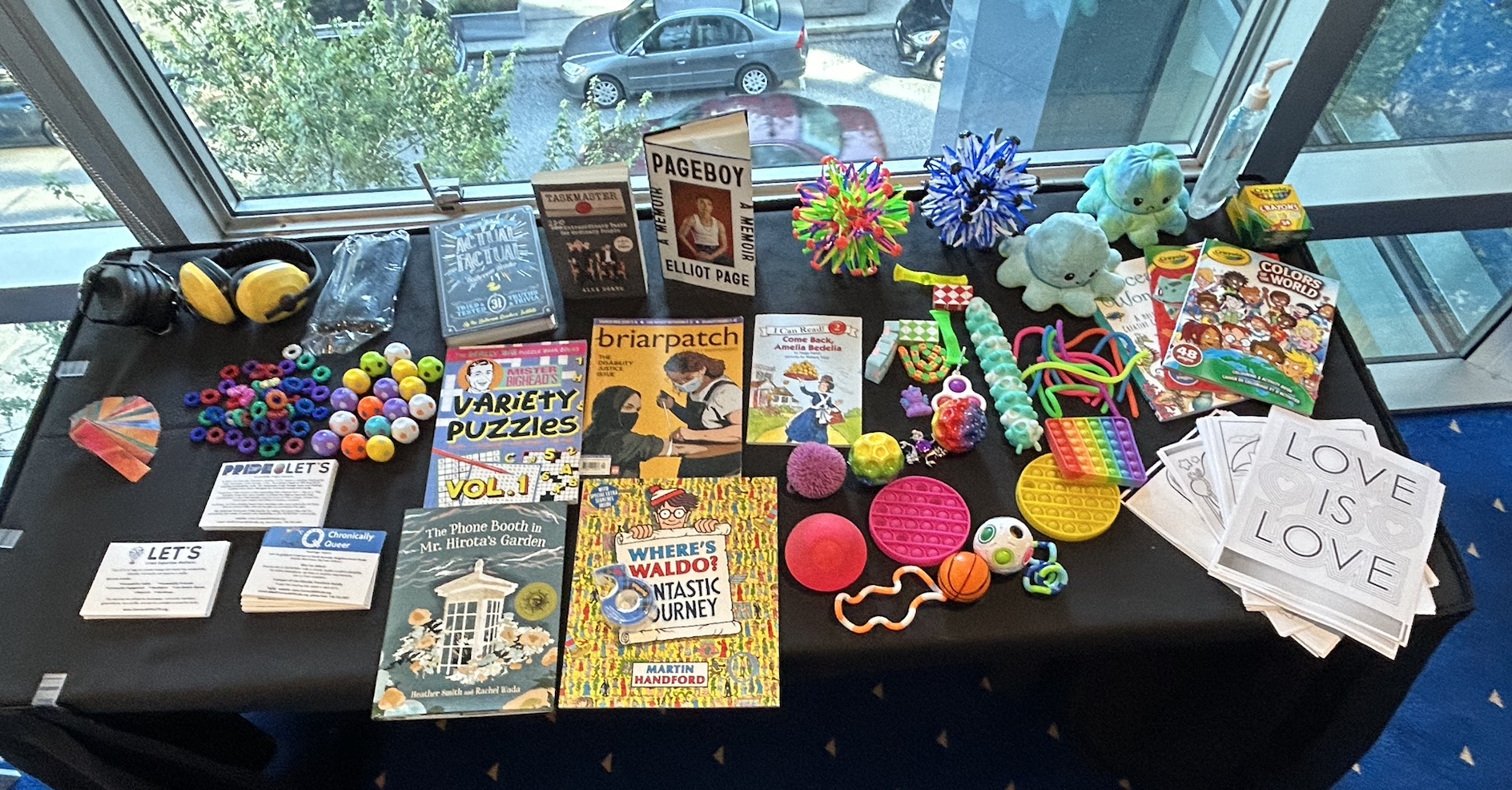 A table from the LET’S’ low sensory space at the Canada Pride Human Rights Summit.