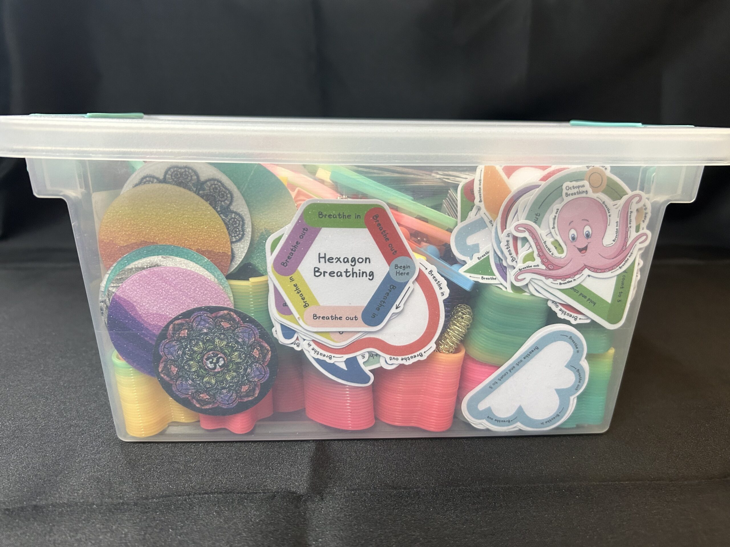 Clear container with sensory items.