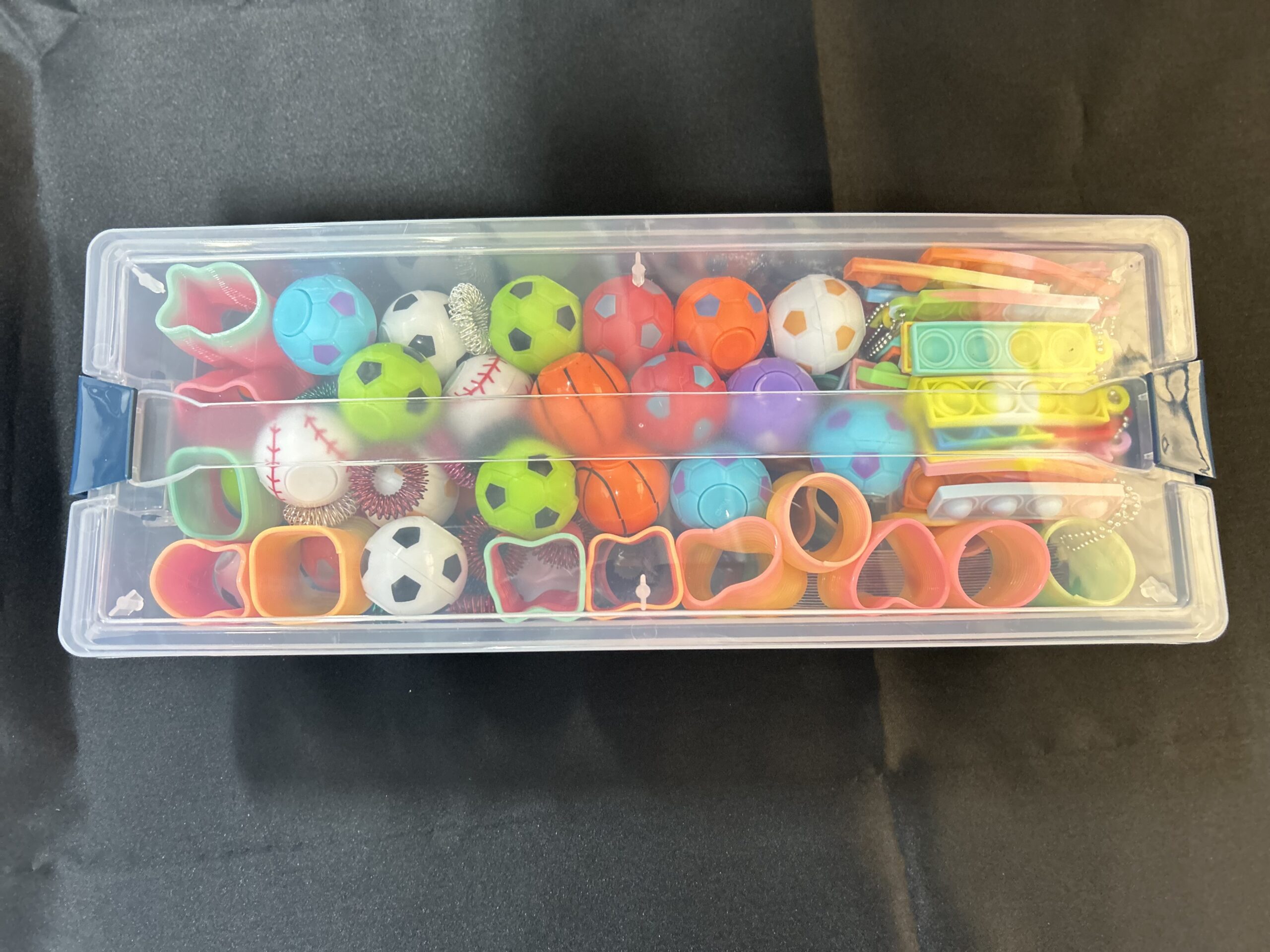 Clear box with sensory items.
